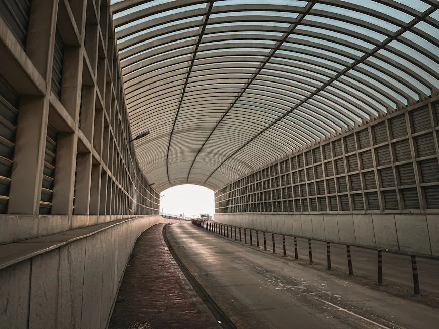 Wide open traffic corridor tunnel with clear unobstructed path showing proper corridor design and flow