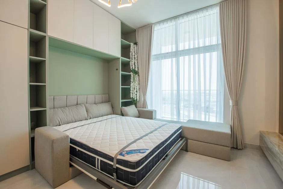 Murphy wall bed pulled down in small modern bedroo