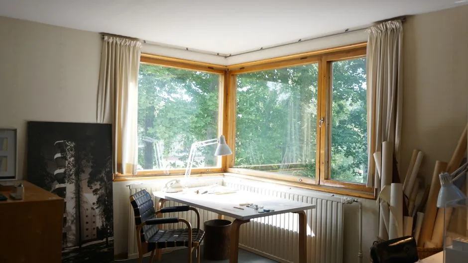 Corner desk placement with architect lamp in bay window corner showing effective lamp positioning in workspace