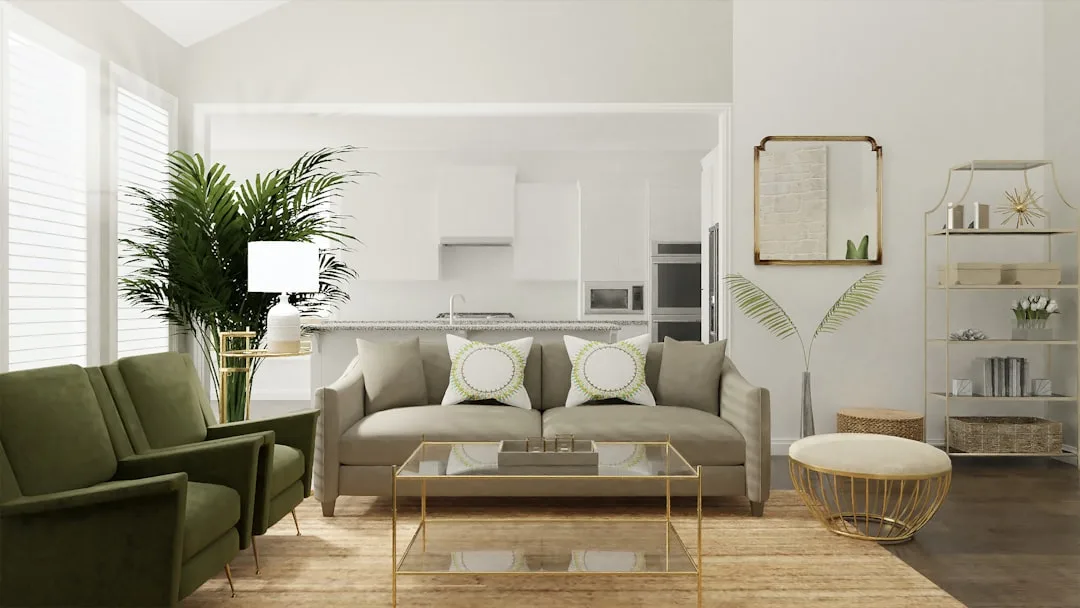 Neutral living room with warm beige sofa, gold accents, green plants, and natural light showing balanced warm color sche