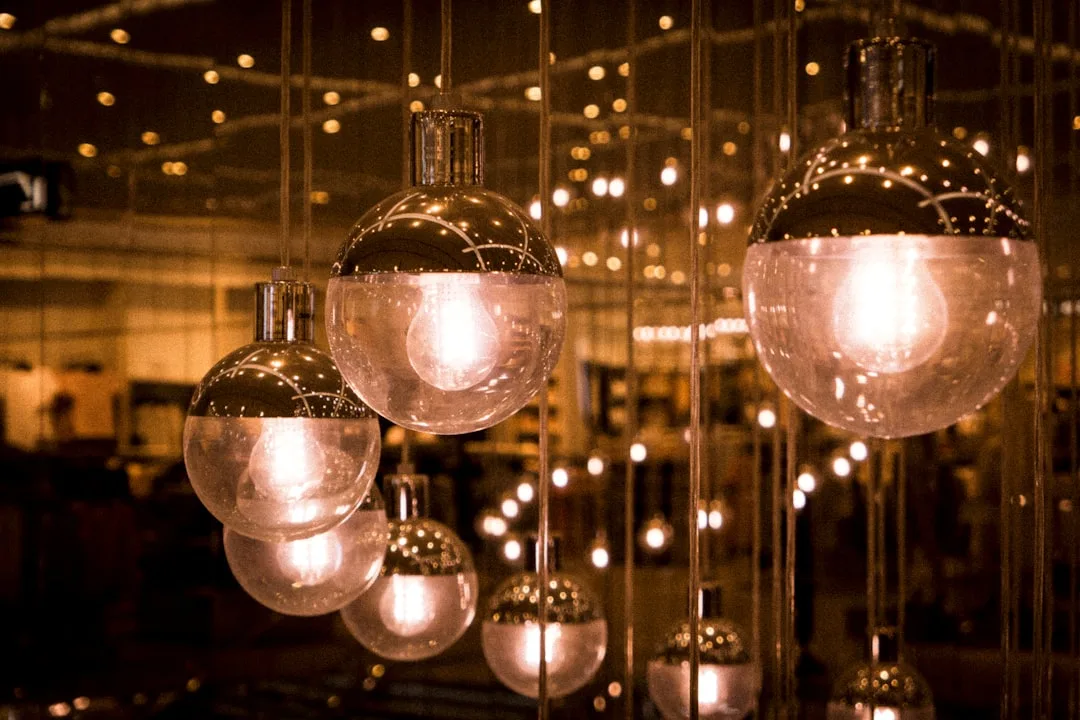 Hanging globe pendant light fixtures with warm glowing bulbs illustrating decorative lighting placement and fixture desi