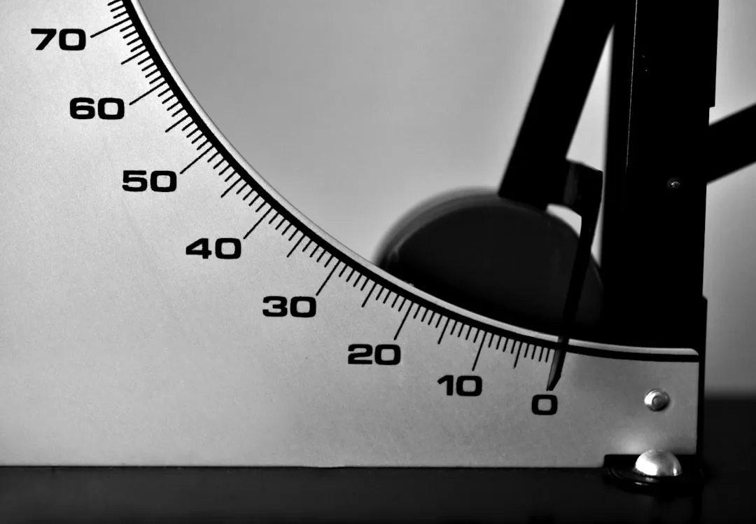 Close-up of a lamp shade angle gauge showing degree markings from 0 to 70 for precise shade adjustment