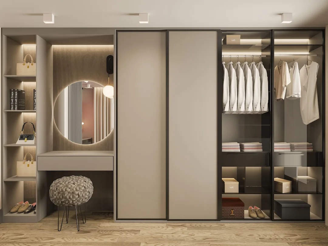Modern built-in wardrobe with sliding doors, open shelving, vanity mirror, and organized clothing storage sections