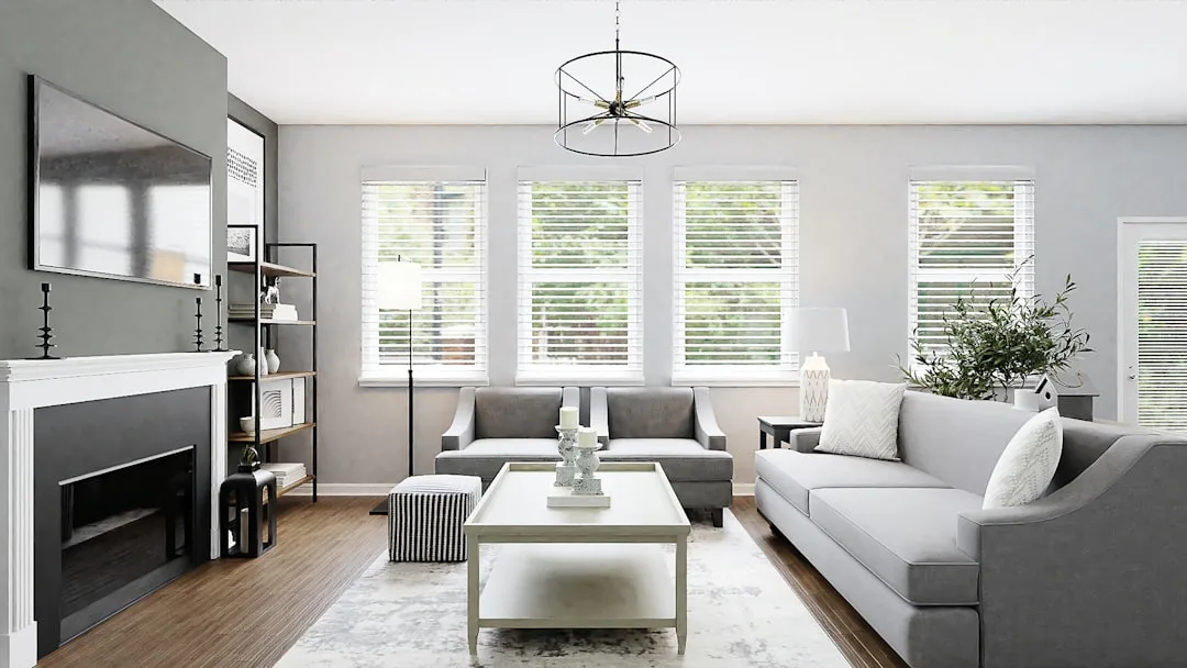 Modern living room with gray walls and gray sofa showcasing cool blue-gray paint undertones in neutral decor