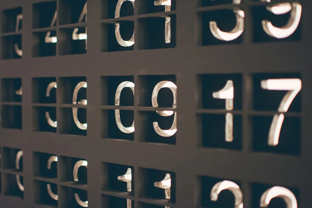 Grid of numbered metal plaques with backlit numerals illustrating measurement thresholds in suite planning design