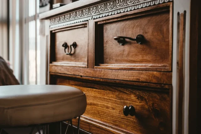 Antique wooden dresser with mixed hardware styles