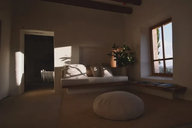 Warm white interior room with natural sunlight cas