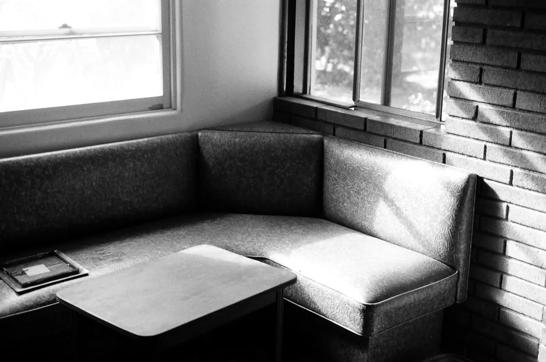 Black and white photo of a built-in corner banquet