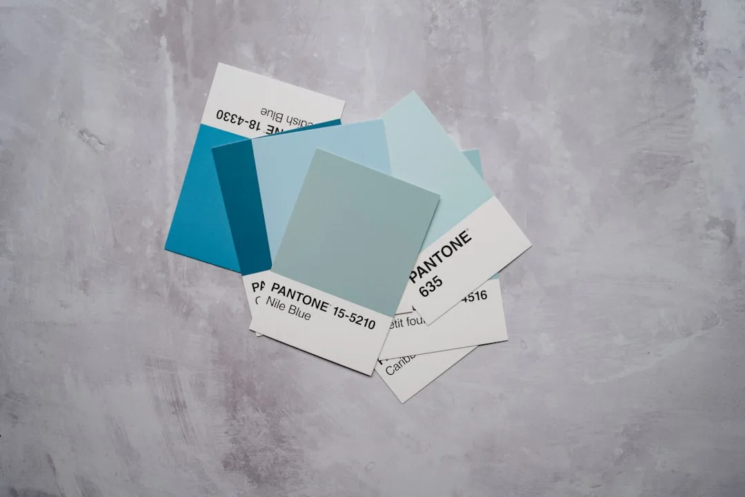 Pantone color swatches in shades of blue including Nile Blue 15-5210 replacing gray interior trends 2026