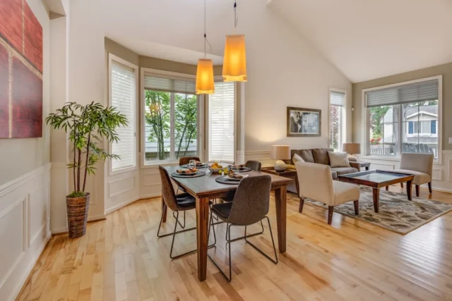 Open-concept dining and living room with hardwood