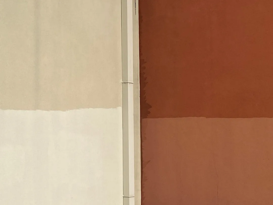 Warm white and terracotta wall paint comparison showing the spectrum from barely warm white to deeper cream tones