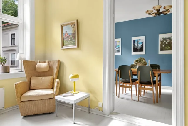 Yellow living room and blue dining room showing ho