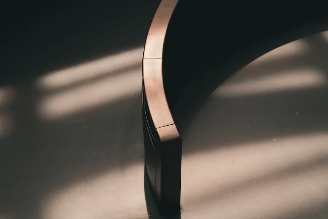 Arc floor lamp curved arm detail with dramatic sha