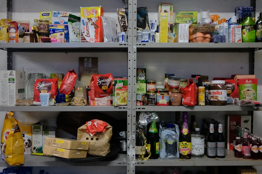 Overcrowded deep pantry shelves with products push