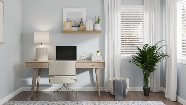 Minimalist floating wood desk with laptop and lamp
