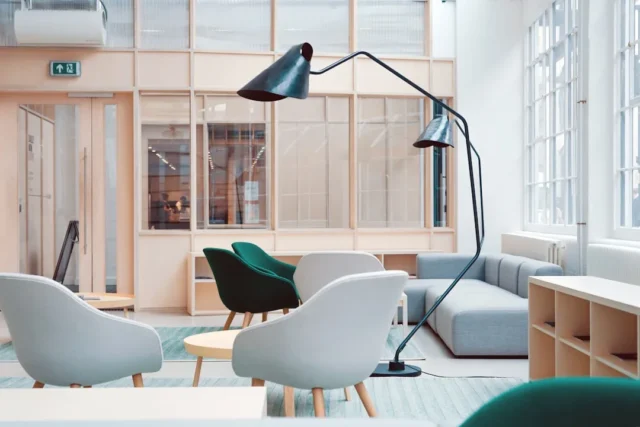 Modern office lounge with large arc floor lamp, li