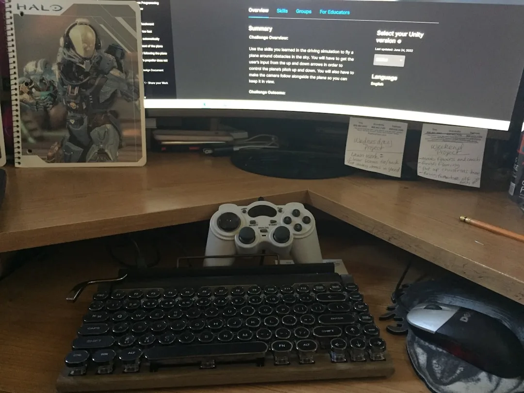 Cluttered corner desk setup with retro keyboard, g