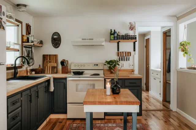Small eat-in kitchen with dark cabinets, butcher b