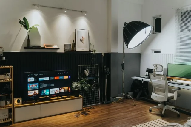 Home office and living room combo setup with TV en