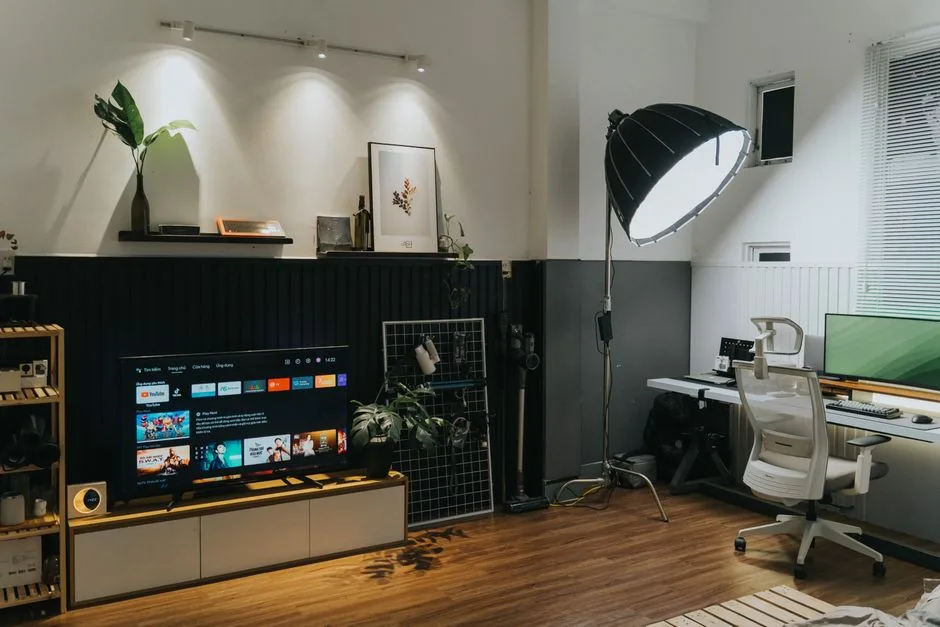 Home office and living room combo setup with TV en