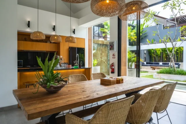 Rustic solid wood dining table with wicker chairs