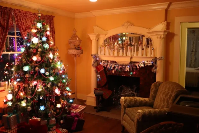 Cozy living room with decorated Christmas tree, li