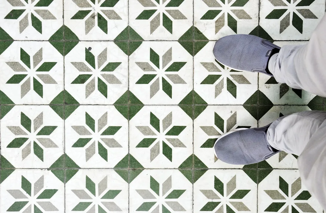 Person standing on decorative green and white geom