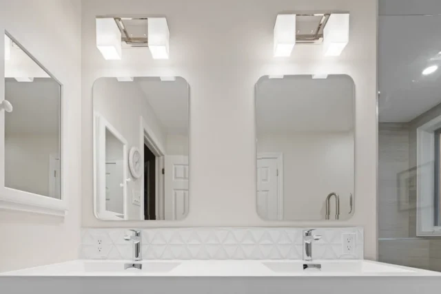 Bathroom vanity with two mirrors and chrome wall s