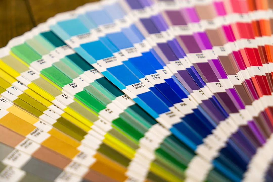 Pantone color swatch fan deck spread showing full spectrum of colors for productivity and design reference