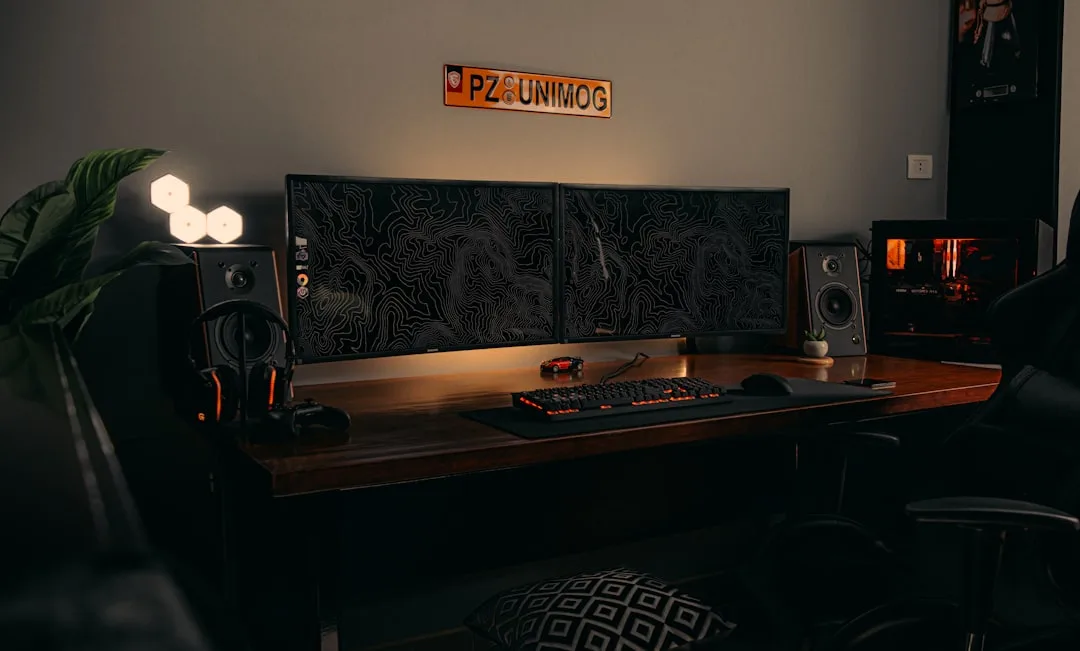 Gaming desk setup with dual monitors, mechanical k